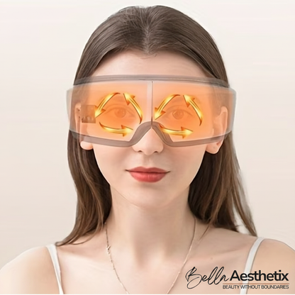 Person wearing Bella Aesthetix eye massager with heat therapy glow